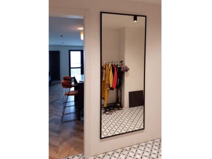 suspended-rectangular-mirror-in-black-frame-photo
